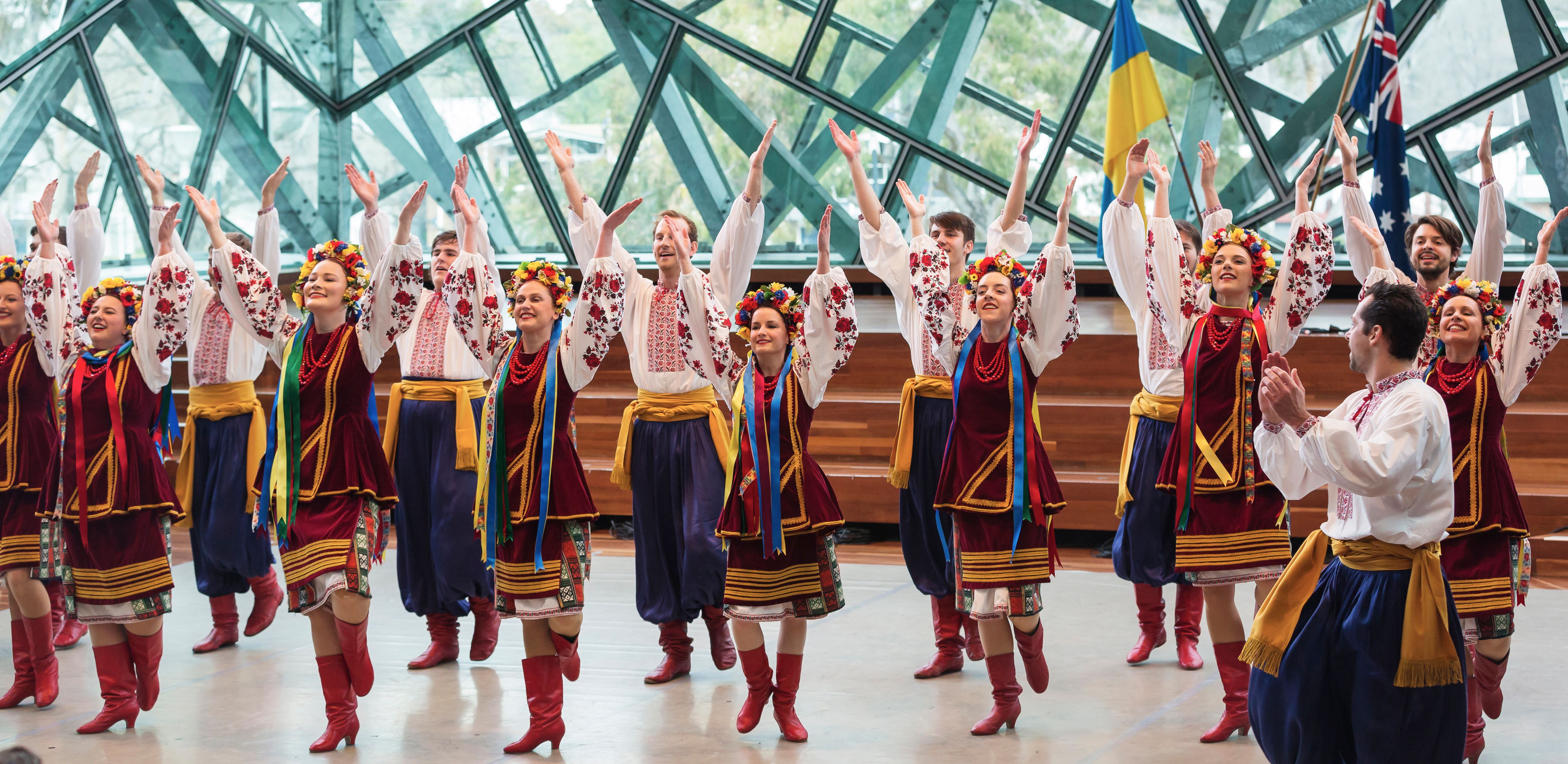 Performers in traditional Ukrainian clothing presenting folk dance as an example of cultural exchange.