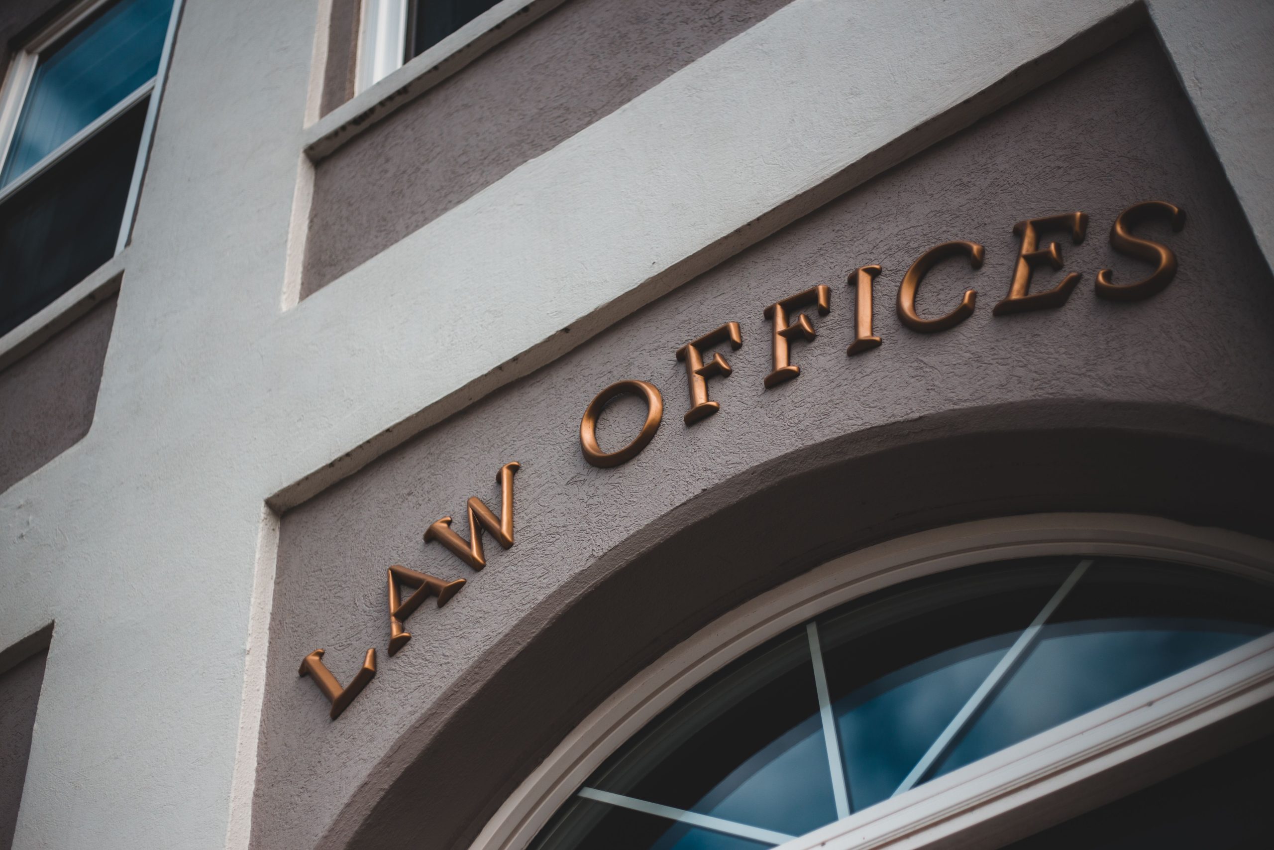 Modern law office exterior with an elegant facade and arched entrance
